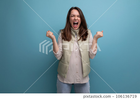 happy cute young brunette woman screaming with joy 106136719
