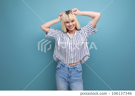 positive blond 25 year old female person in a striped blouse and jeans positive blond 25 year old female person in a striped blouse and jeans 106137346