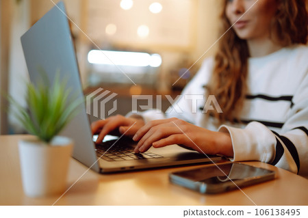 Close-up picture of female hands working on laptop. Social networking technology concept. Lifestyle. Close-up picture of female hands working on laptop. Social networking technology concept. Lifestyle. 106138495