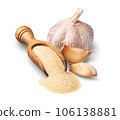 Wooden scoop with dried garlic isolated on white 106138881