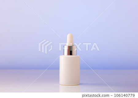One white glass cosmetic bottle on the table. Close-up, copywriting. Beauty blog, salon care concept, minimalistic brand packaging mockup 106140779