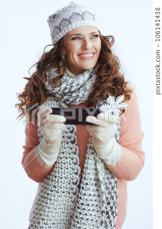 smiling stylish female sending text message using smartphone 106141438