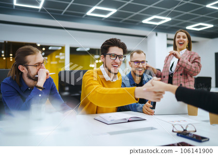 Group of young businesspeople working together in creative office. Planning, analysis, collaborate. 106141900