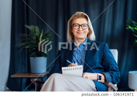 Portrait of smiling 50's stylish, confident mature businesswoman, middle aged company ceo director, experienced senior female professional, business coach team leader in modern office. Female leader 106141971