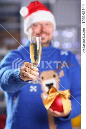 Bearded smiling man wearing warm blue sweater 106142544