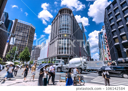The cityscape of Tokyo, Japan, in front of Mitsukoshi-mae Station where the summer sky spreads out. Overlooking Nihonbashi Mitsukoshi, etc. = August 10 The cityscape of Tokyo, Japan, in front of Mitsukoshi-mae Station where the summer sky spreads out. Overlooking Nihonbashi Mitsukoshi, etc. = August 10 106142584