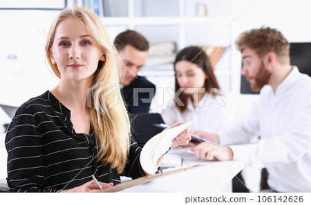 Beautiful smiling cheerful girl at workplace Beautiful smiling cheerful girl at workplace 106142626