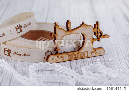 sewing tape, sewing machine and wood mannequin 106143345