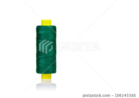skein of thread green colors macro on a white background 106143388