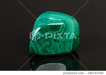 macro mineral stone malachite on a black background macro mineral stone malachite on a black background 106143394