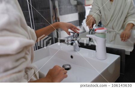 Woman hands from tap for washing hands Woman hands from tap for washing hands 106143630