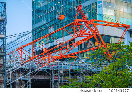 Tokyo cityscape, Japan A large crane fixed low. Looking for redevelopment of Shibuya Station from Hachiko Square side ... = August 14 Tokyo cityscape, Japan A large crane fixed low. Looking for redevelopment of Shibuya Station from Hachiko Square side ... = August 14 106143977