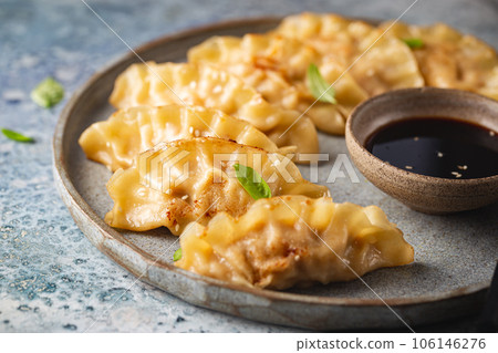 Asian dumplings with soy sauce Asian dumplings with soy sauce 106146276