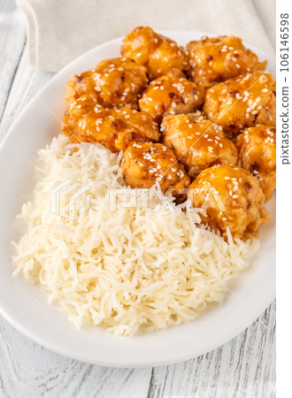 Portion of orange chicken 106146598