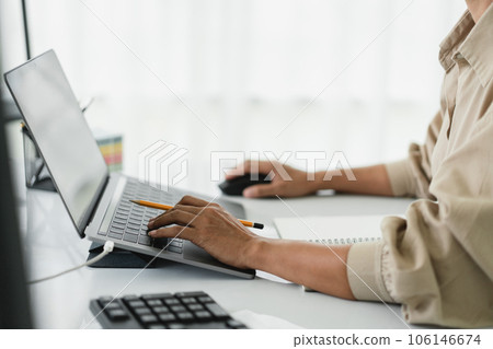 Developer programmer using mouse and typing code on laptop while programming to developing website 106146674