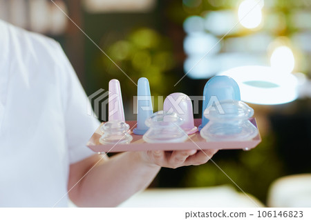 Closeup on female massage therapist in spa salon 106146823