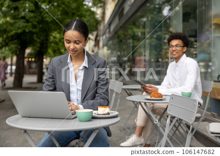 Colleagues working on project together and looking focused 106147682