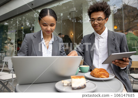 Colleagues working on project together and looking focused 106147685