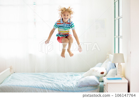 Child playing in bed. Kids room. Boy at home. 106147764