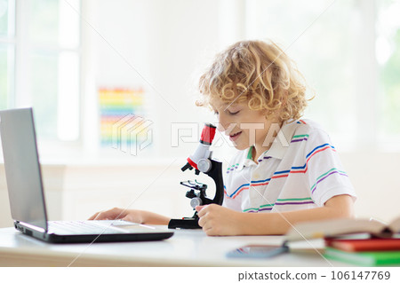 School kids with microscope. Science class. School kids with microscope. Science class. 106147769