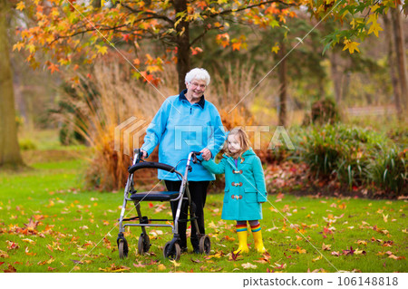 Senior lady with walker enjoying family visit 106148818