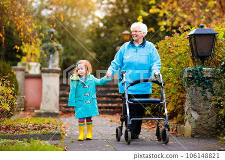 Senior lady with walker enjoying family visit 106148821