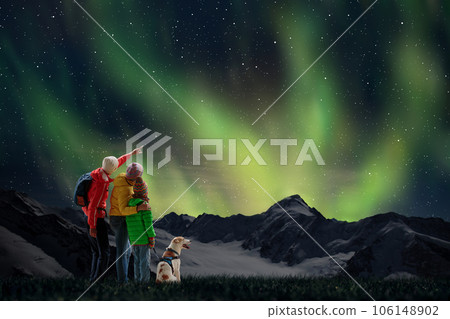 Family watching northern lights. Aurora night sky. 106148902