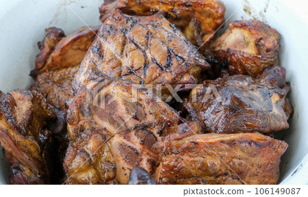 Close up on details of homemade chicken steak on barbecue grill. Barbecue, grill and food concept. 106149087