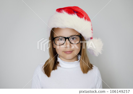 Young child girl Santa on white background, Christmas portrait Young child girl Santa on white background, Christmas portrait 106149257