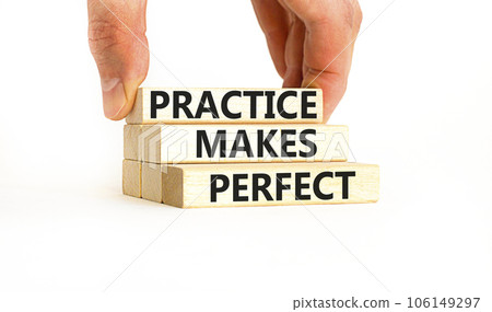 Practice makes perfect symbol. Concept words Practice makes perfect on wooden block. Beautiful white table white background. Businessman hand. Business practice makes perfect concept. Copy space. Practice makes perfect symbol. Concept words Practice makes perfect on wooden block. Beautiful white table white background. Businessman hand. Business practice makes perfect concept. Copy space. 106149297