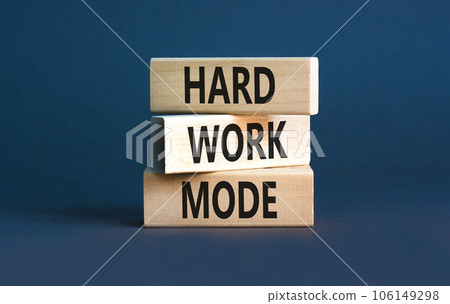 Hard work mode symbol. Concept words Hard work mode on wooden block on a beautiful grey table grey background. Business and Hard work mode concept. Copy space. Hard work mode symbol. Concept words Hard work mode on wooden block on a beautiful grey table grey background. Business and Hard work mode concept. Copy space. 106149298