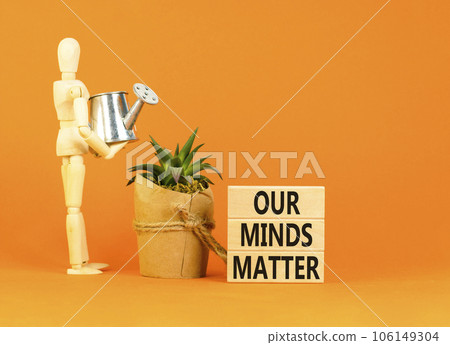 Our minds matter ourmindsmatter symbol. Concept words Our minds matter on wooden block. Beautiful orange table orange background. Businessman model. Our minds matter ourmindsmatter concept. Copy space 106149304