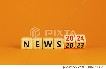 2024 News new year symbol. Businessman turns a wooden cube and changes words News 2023 to News 2024. Beautiful orange table orange background, copy space. Business 2024 news new year concept. 2024 News new year symbol. Businessman turns a wooden cube and changes words News 2023 to News 2024. Beautiful orange table orange background, copy space. Business 2024 news new year concept. 106149334