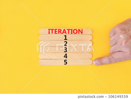 Time to iteration 5 symbol. Concept word Iteration 1 2 3 4 5 on wooden sticks. Businessman hand. Beautiful yellow table yellow background. Business planning and time to iteration 5 concept. Copy space Time to iteration 5 symbol. Concept word Iteration 1 2 3 4 5 on wooden sticks. Businessman hand. Beautiful yellow table yellow background. Business planning and time to iteration 5 concept. Copy space 106149339