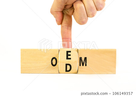 OEM or ODM symbol. Concept word OEM ODM original design equipment manufactirer on wooden block. Businessman hand. Beautiful white table white background, copy space. Business and OEM ODM concept. OEM or ODM symbol. Concept word OEM ODM original design equipment manufactirer on wooden block. Businessman hand. Beautiful white table white background, copy space. Business and OEM ODM concept. 106149357