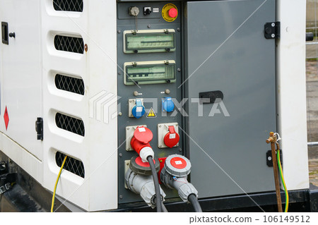 A fragment of a connected large mobile diesel charging generator control panel A fragment of a connected large mobile diesel charging generator control panel 106149512