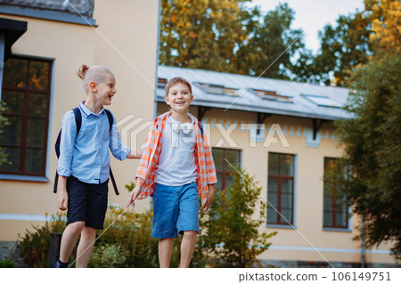 smiling caucasian handsome children go home from school smiling caucasian handsome children go home from school 106149751