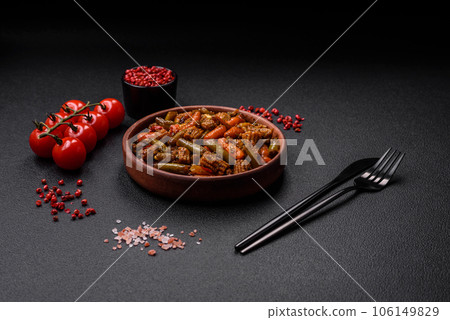 Mix of vegetables corn, carrots, peppers, broccoli, onions in teriyaki sauce on a ceramic plate Mix of vegetables corn, carrots, peppers, broccoli, onions in teriyaki sauce on a ceramic plate 106149829