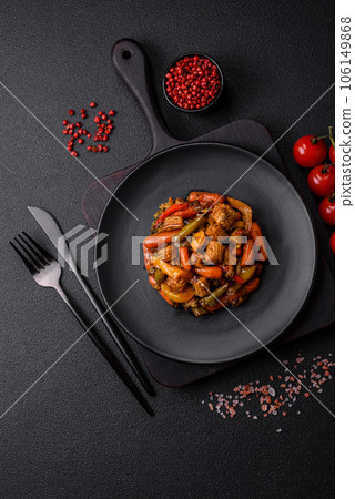 Mix of vegetables corn, carrots, peppers, broccoli, onions in teriyaki sauce on a ceramic plate Mix of vegetables corn, carrots, peppers, broccoli, onions in teriyaki sauce on a ceramic plate 106149868