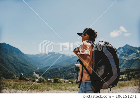 caucasian tourist boy with backpack in mountains 106151271
