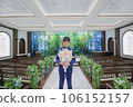 man with bouquet in chapel 106152157