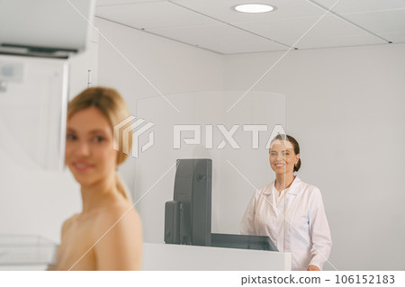 Professional radiologist doing mammogram x ray for young woman to check for breast cancer 106152183