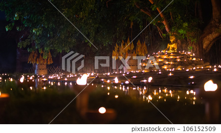 Candle Light with Buddha Statue at Wat Pan Tao Temple with beautiful water reflection in Phan Tao Temple, Chiangmai, Thailand 106152509
