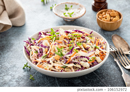 Asian cole slaw with peanuts and green onion 106152972