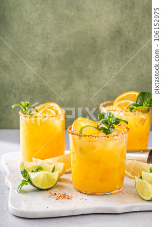 Triple citrus margarita with orange, lemon and lime Triple citrus margarita with orange, lemon and lime 106152975