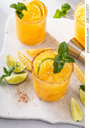Triple citrus margarita with orange, lemon and lime 106152977