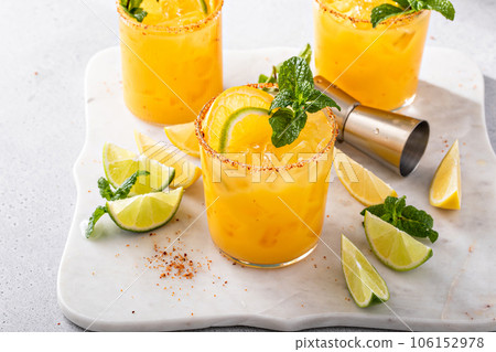 Triple citrus margarita with orange, lemon and lime 106152978
