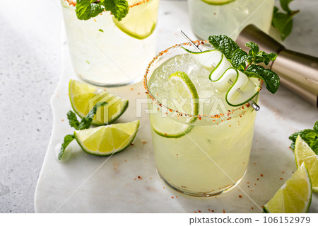 Cucumber margarita with lime and spicy rim Cucumber margarita with lime and spicy rim 106152979