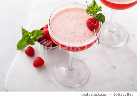 Raspberry martini cocktail with vodka, juice and raspberry liqueur Raspberry martini cocktail with vodka, juice and raspberry liqueur 106152985