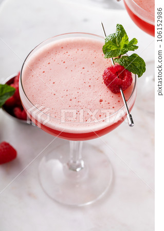 Raspberry martini cocktail with vodka, juice and raspberry liqueur 106152986